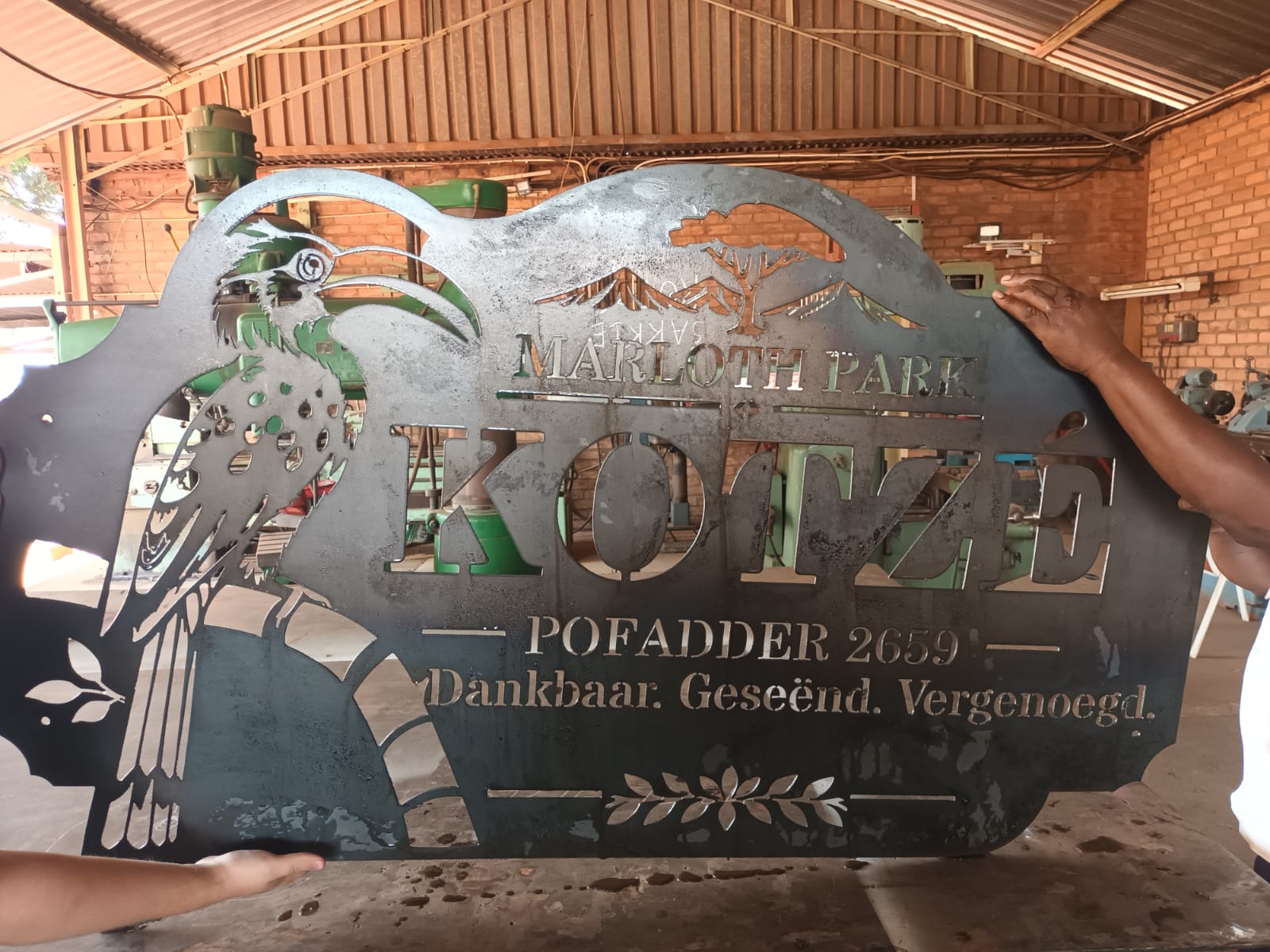 Kotze Marloth Park signboard with a hornbill and tree design, cut from 2 mm mild steel, 1.5 m wide and 1 m high